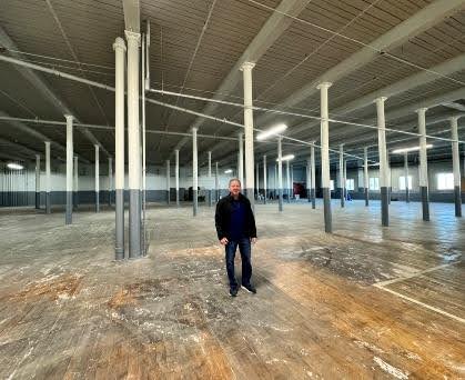 John Caito lll, president of Amerisewn, standing in empty manufacturing factory before move in day.